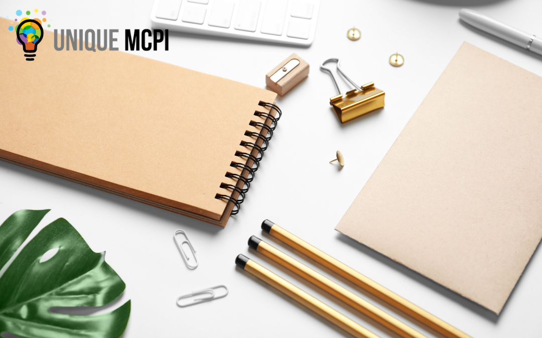 Blank promotional items such as a notebook, pencils, and clips.